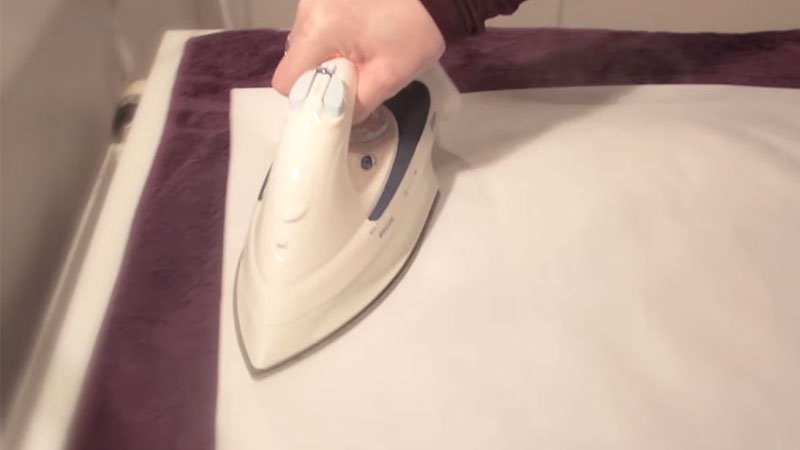 Hold Steam Iron Over Back Of Canvas