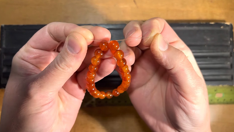 The best knot for elastic bracelets How to tie elastic bracelet knots that  last   YouTube