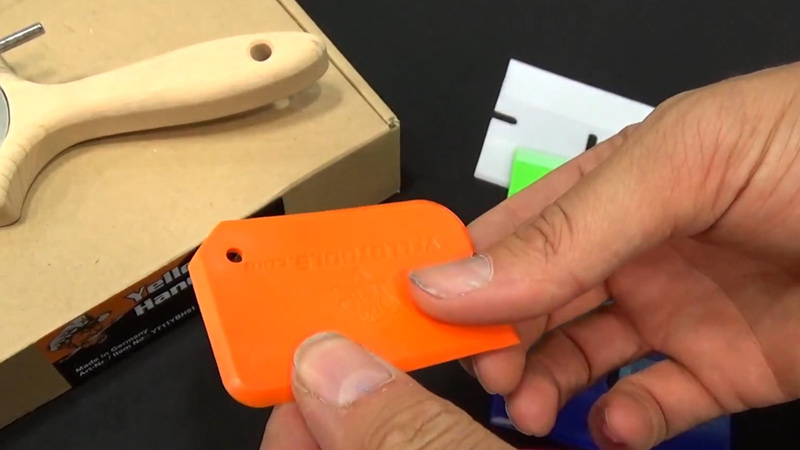 Use a plastic scraper